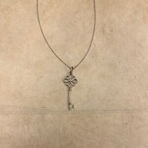 Tiffany & Co. Silver Key Necklace with blue sapphire